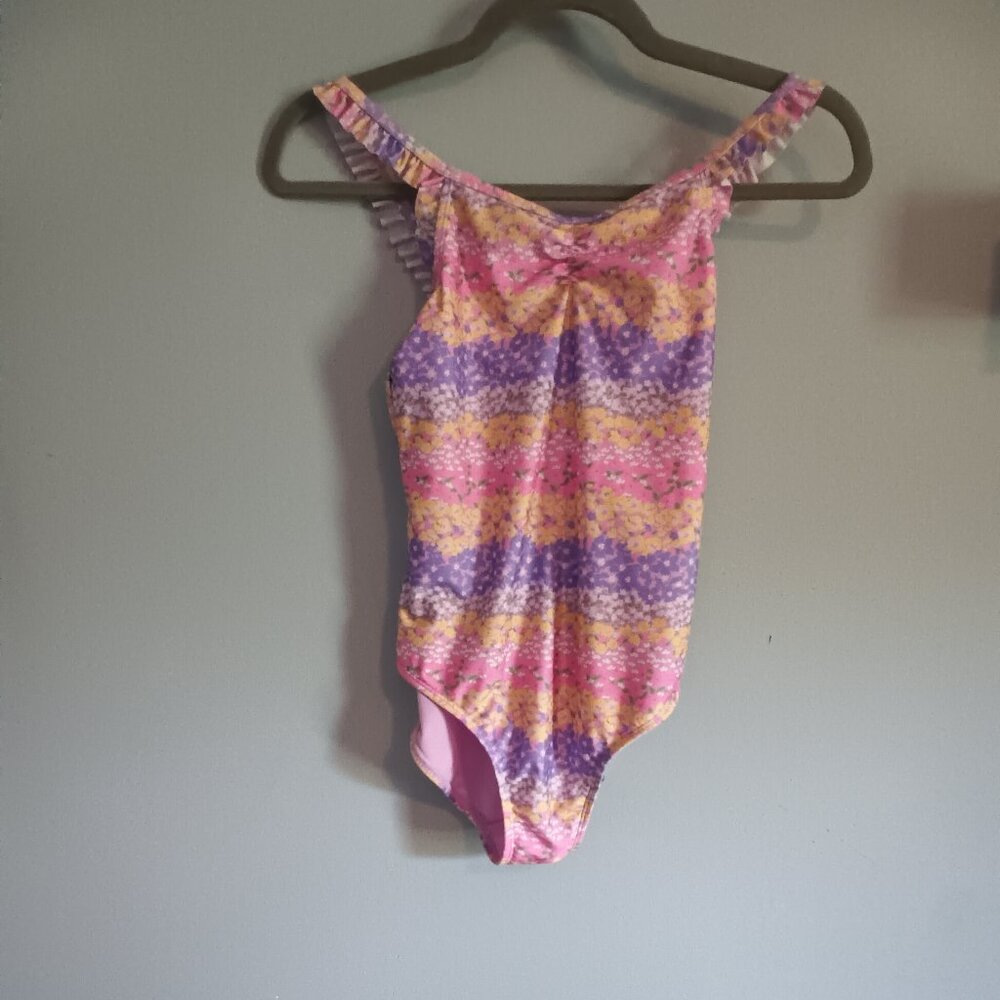 Pink, purple, and orange floral swim suit